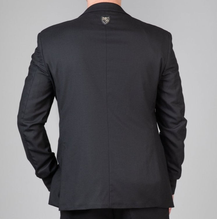 Rückenansicht des sportlichen Signature Anzugs - flexible Passform und dezentes, kraftvolles Design für maskuline Eleganz.